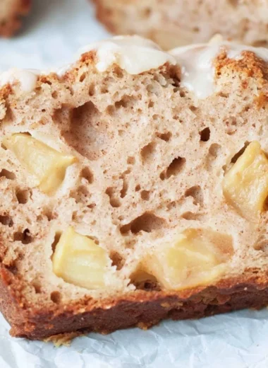 Freshly baked sourdough apple bread with chunks of apple and a golden crust.