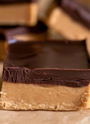Delicious homemade Buckeye Bars with chocolate and peanut butter layers.