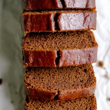 Delicious classic gingerbread loaf cake on a rustic wooden table