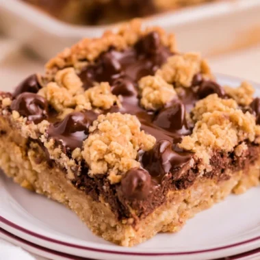 Cozy chocolate peanut butter oatmeal bars on a wooden table