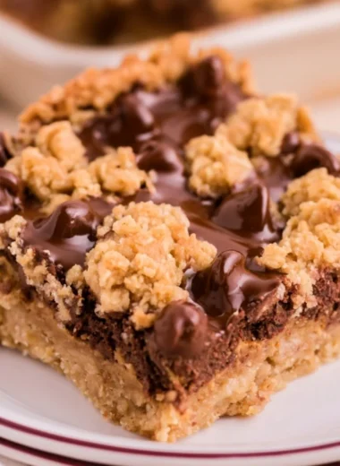 Cozy chocolate peanut butter oatmeal bars on a wooden table