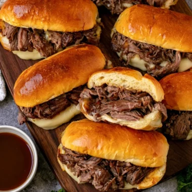 Cozy Crockpot French dip sandwiches served with au jus for dipping
