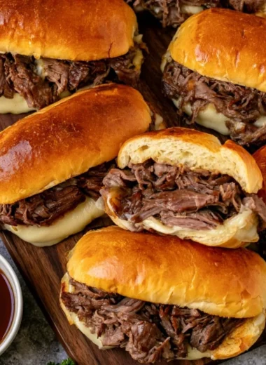 Cozy Crockpot French dip sandwiches served with au jus for dipping