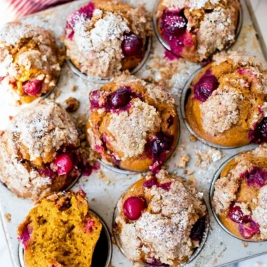 Freshly baked Pumpkin Spice Cranberry Muffins with cranberries and spices